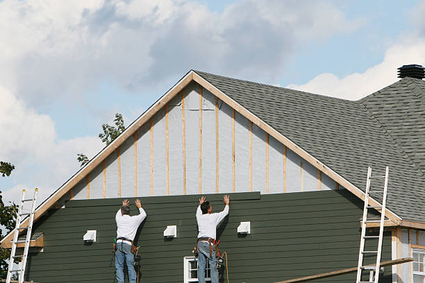 Professional Siding technician working in Cedarhurst, NY